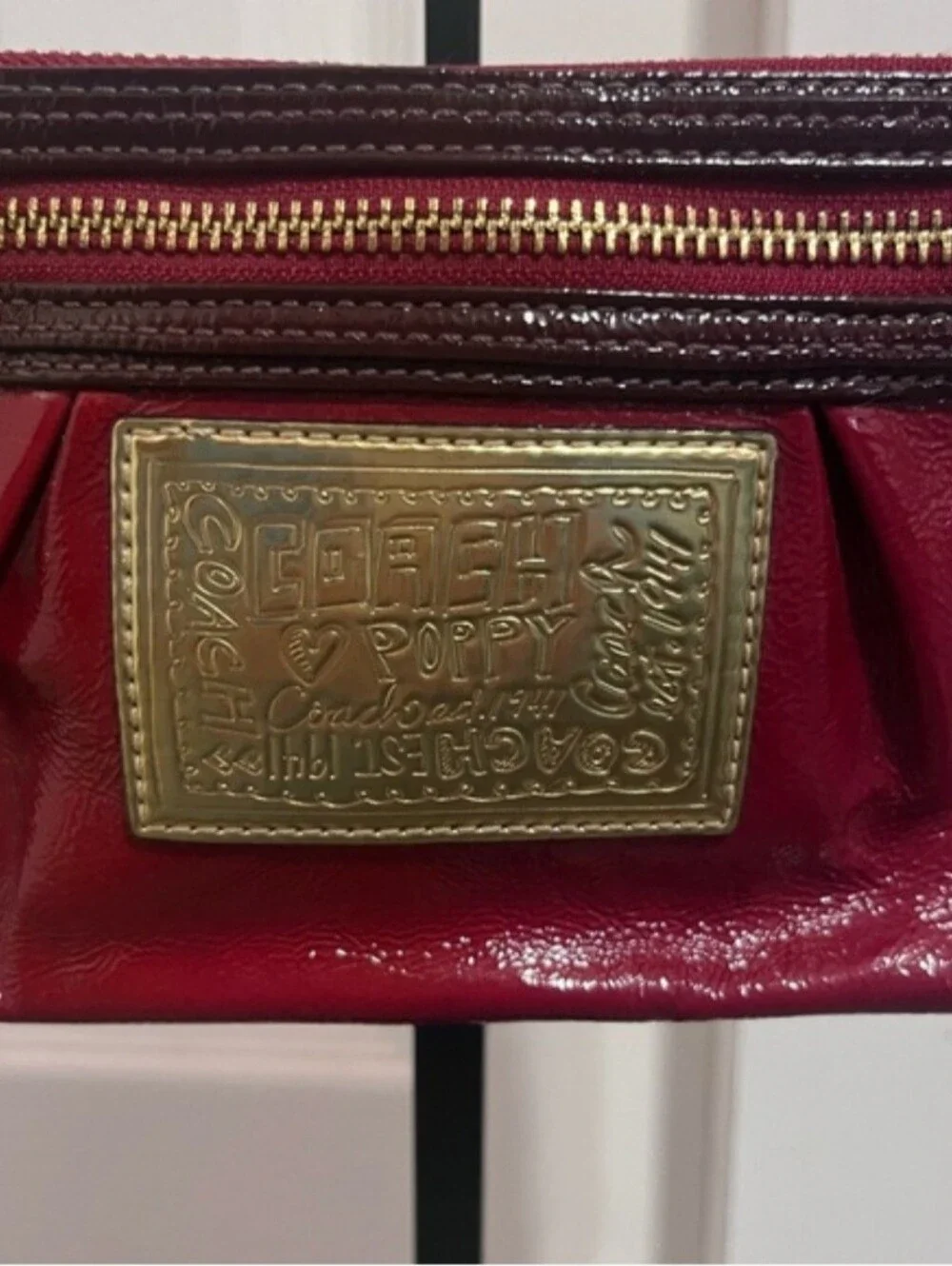 Coach Poppy Red Patent Wristlet with Brass Accents, Minor Callouts, Clean Inside